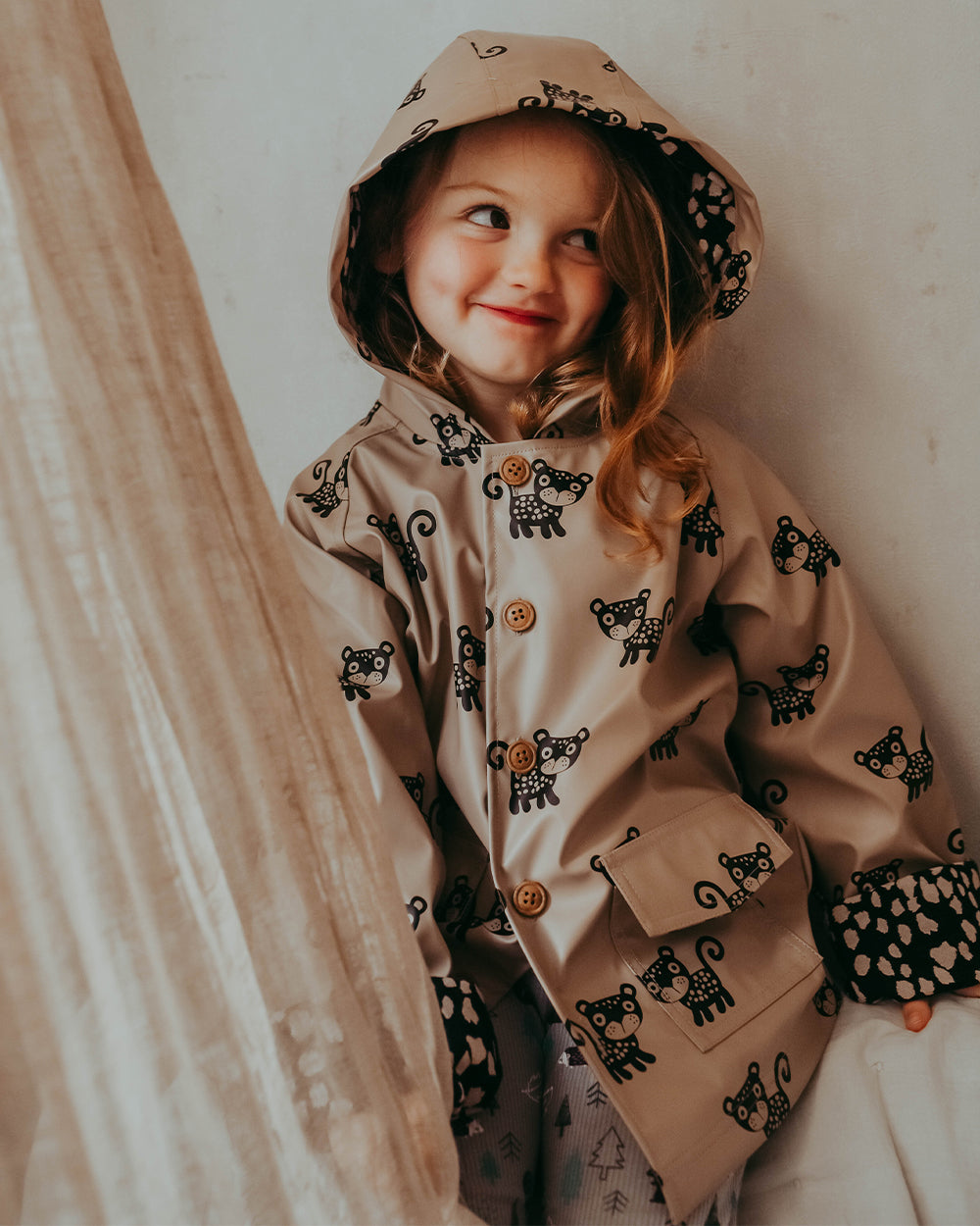 Girl wearing sustainable kids waterproof jacket