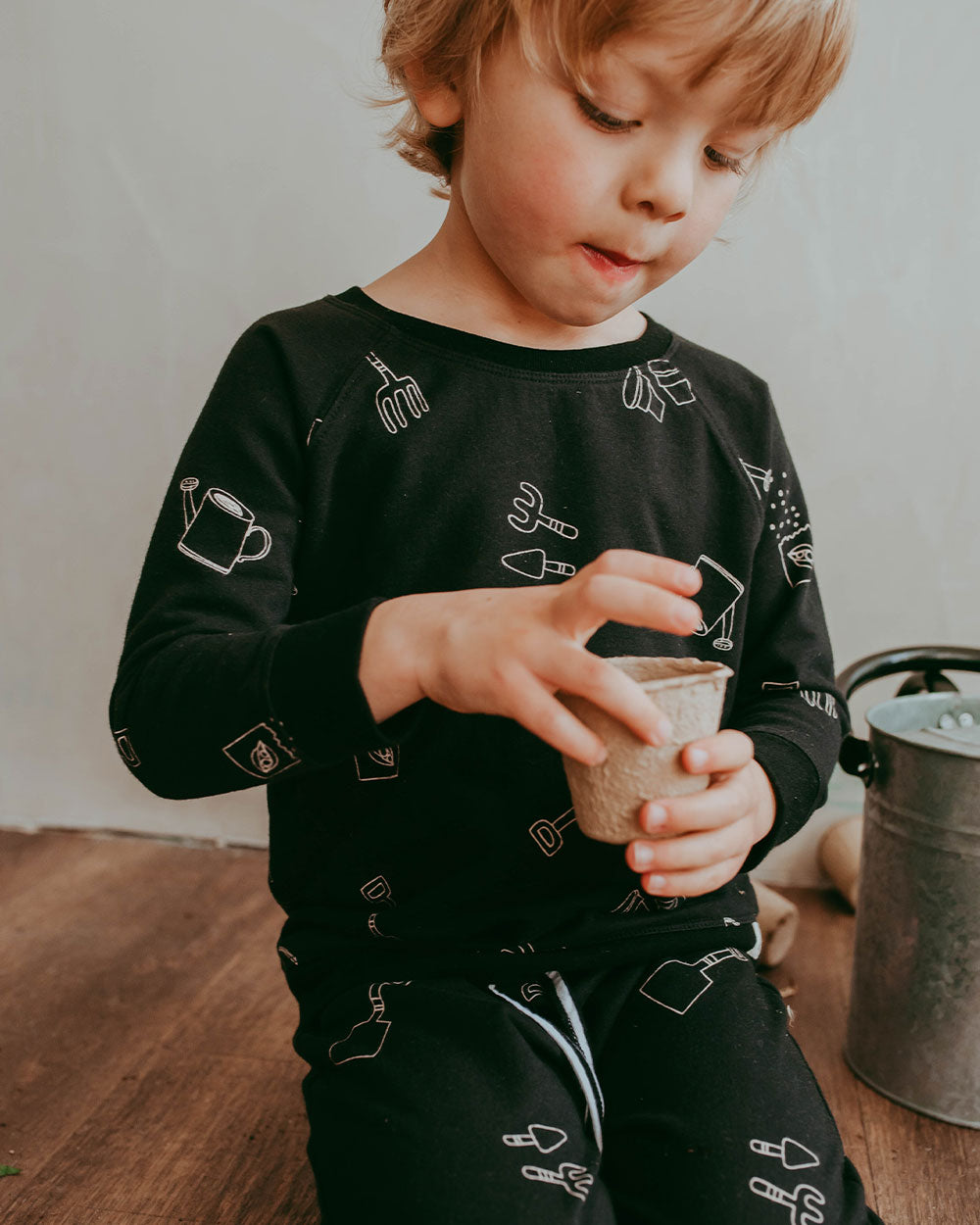 Boy wearing gender-neutral organic cotton kids sweatshirt