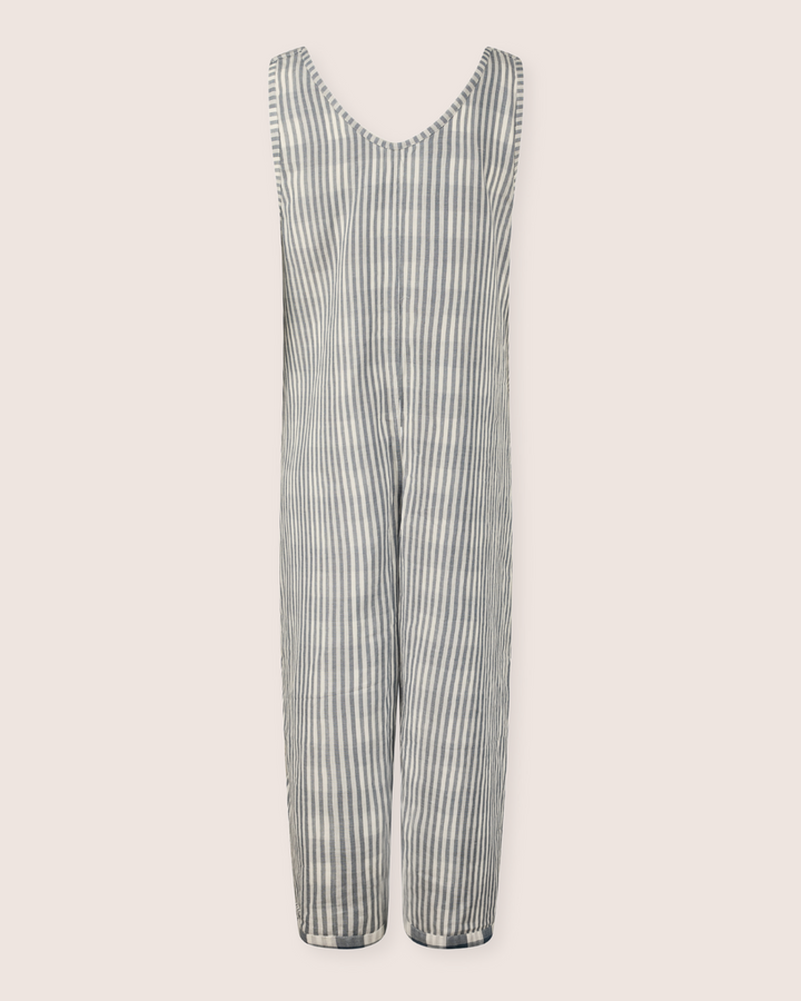 The Grace Reversible Blue Check Dungarees are sleeveless and full-length, featuring blue and white stripes in organic cotton. The lightweight, breathable fabric is perfect for a sustainable wardrobe and includes casual loose-fitting legs with a V-shaped neckline.