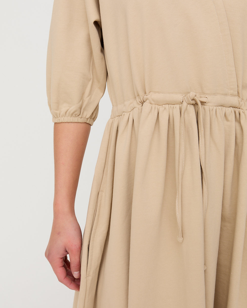 Beige dress with a plain background