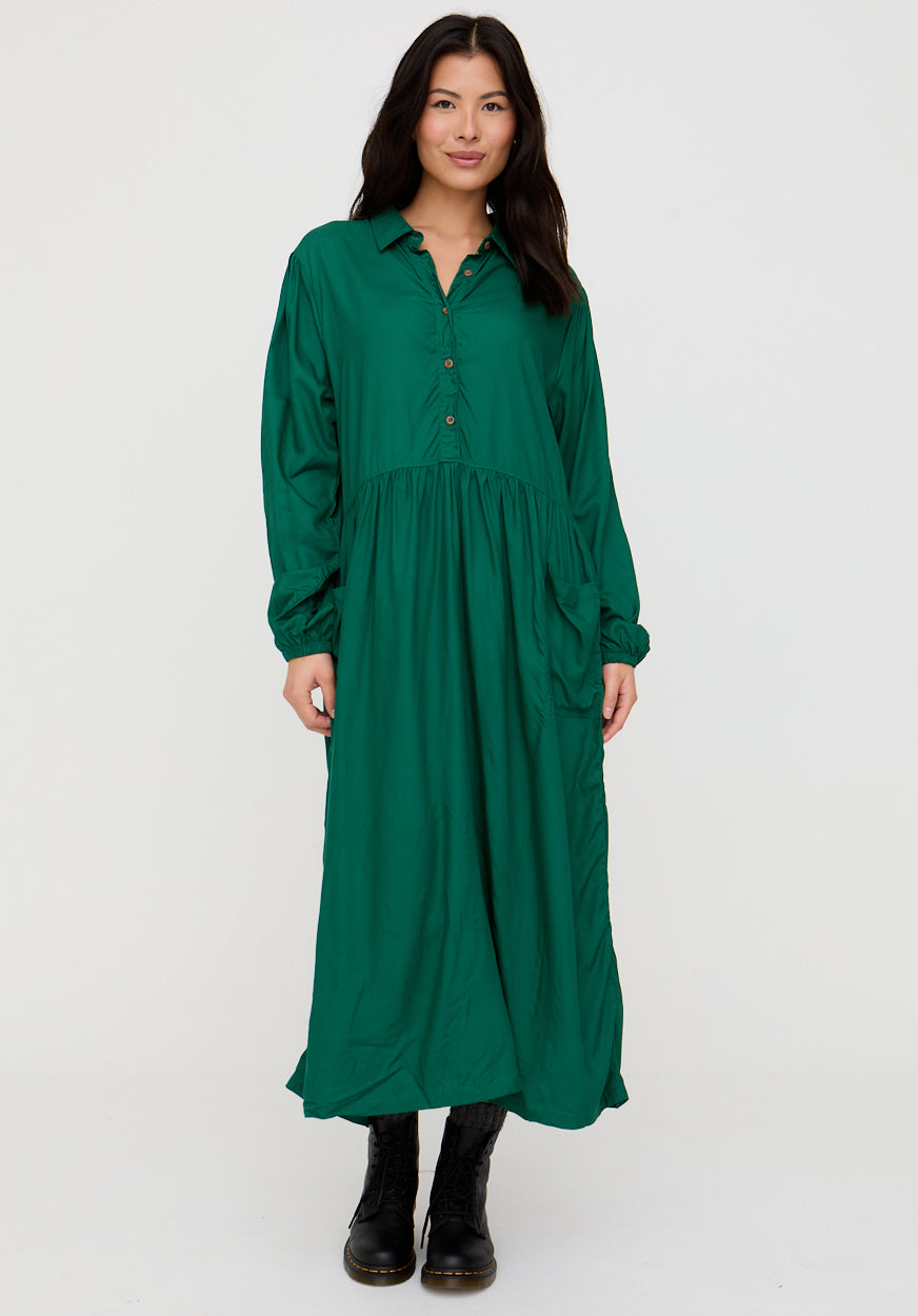 Woman wearing a green dress on a white background