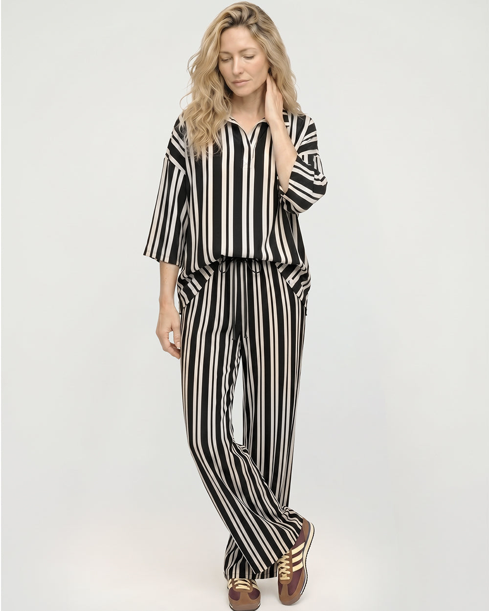 woman wearing brown and white stripe trousers 