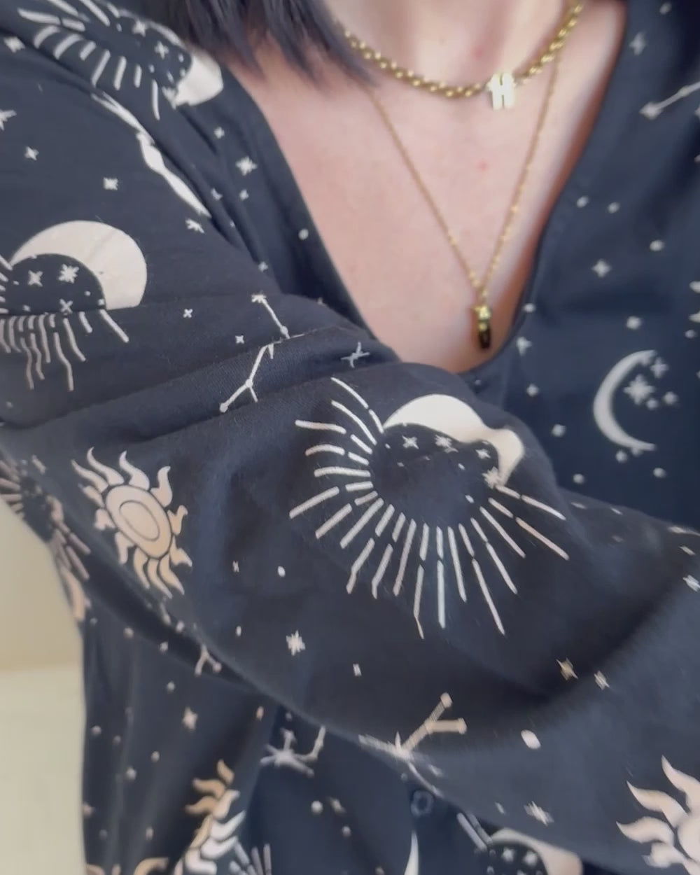 video showing organic cotton Mai Black Astrology Print V- Neck Jumpsuit 
