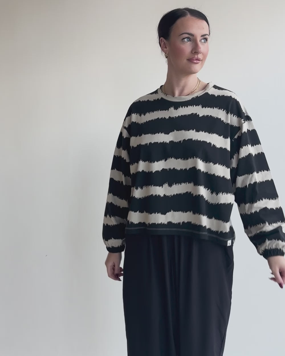 video showing azo free Ivy Black Wavy Stripe Print Sweatshirt