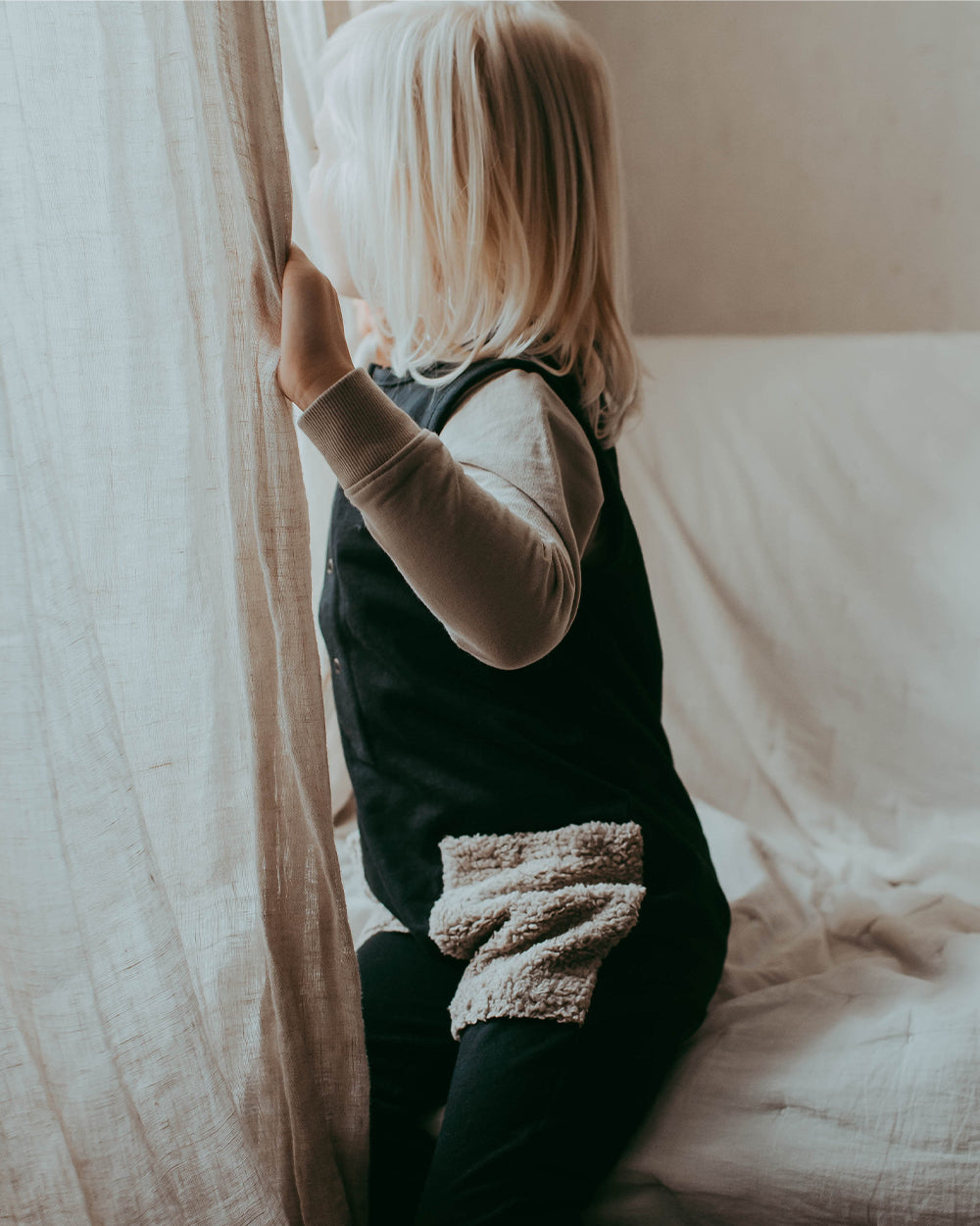 Boy wearing unisex organic cotton kids dungarees