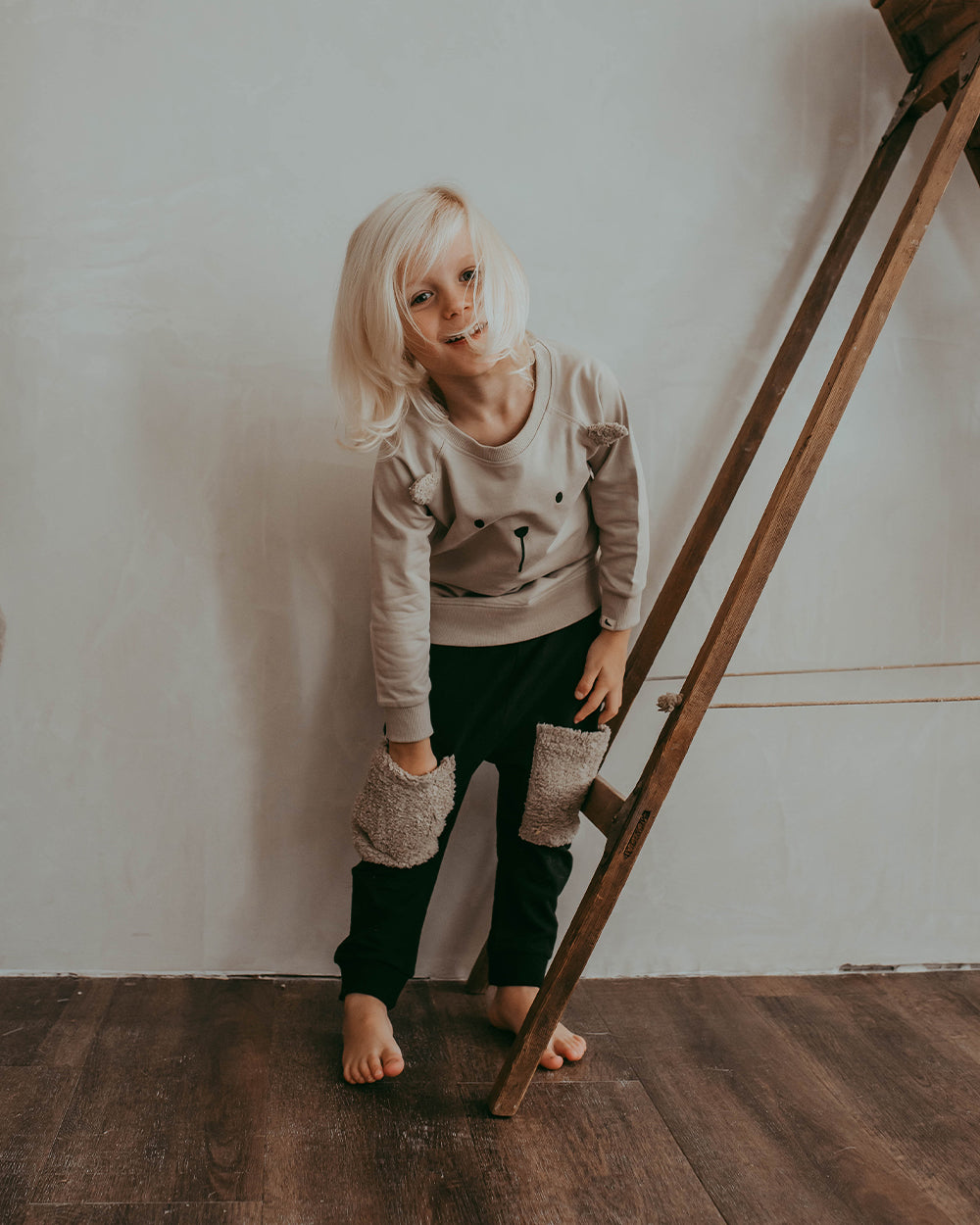 Boy wearing unisex organic cotton kids harems