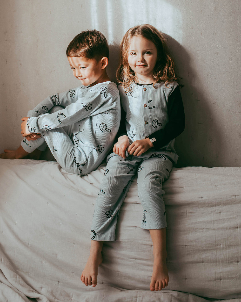 Girl wearing unisex organic cotton kids dungarees