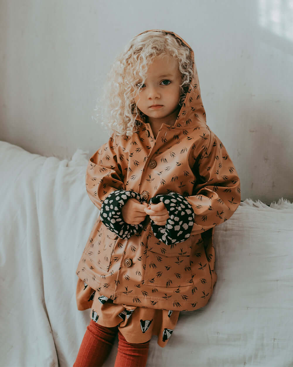 Girl wearing sustainable kids waterproof jacket