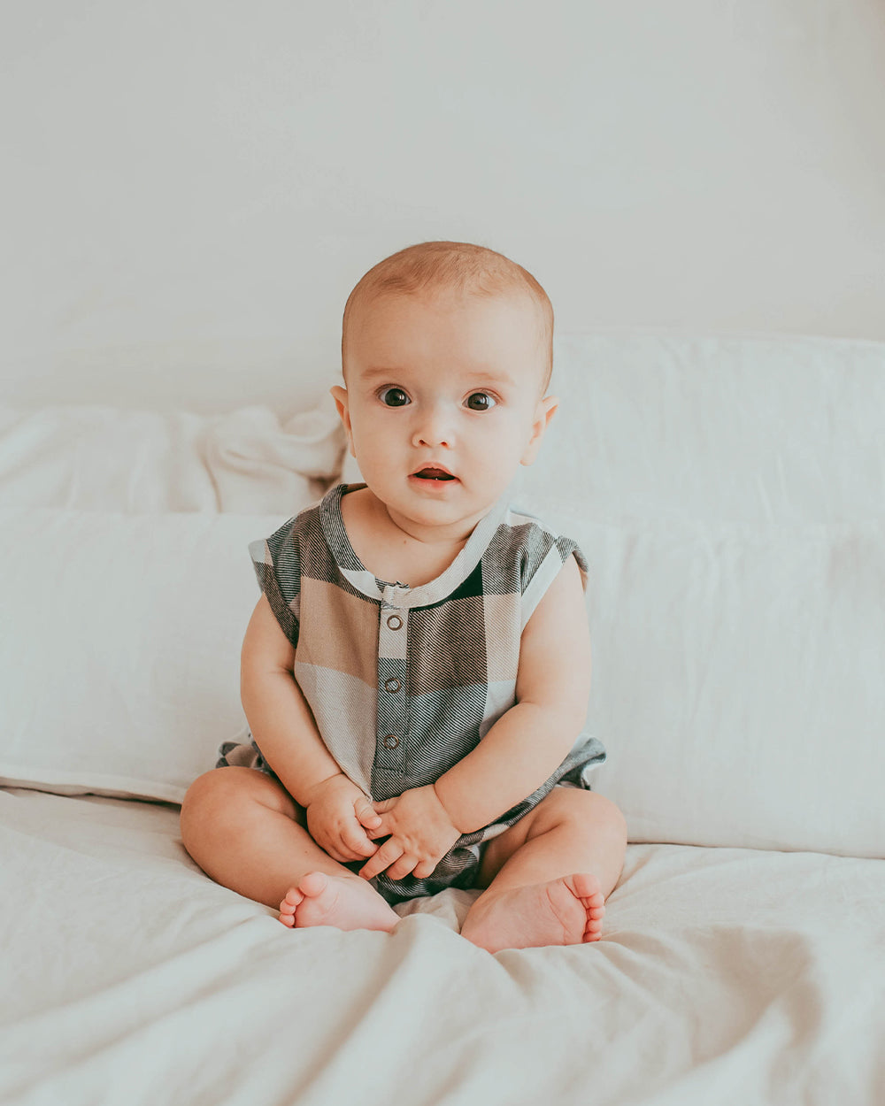 Baby wearing organic cotton baby romper