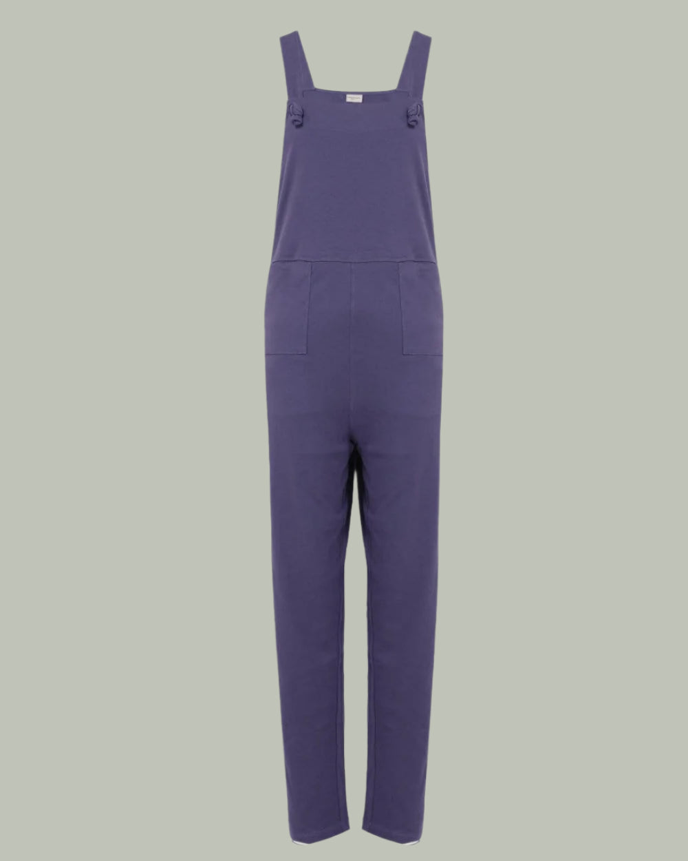 Lila Dark Blue Dungarees with a straight-leg design are shown against a plain, light green background. The garment features adjustable tie straps and two front pockets, blending style and practicality.