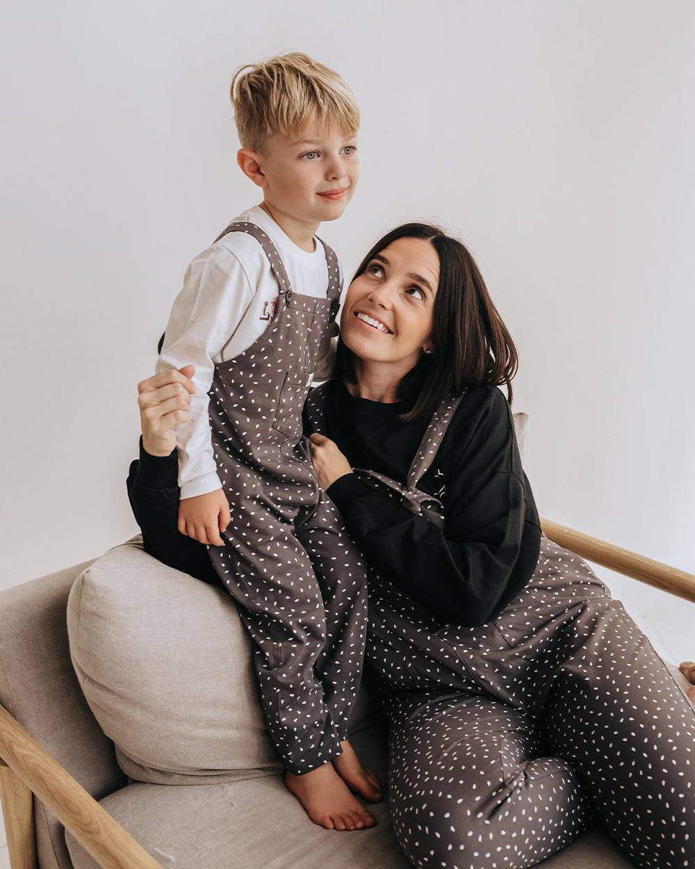 Boy wearing gender-neutral organic cotton kids dungarees