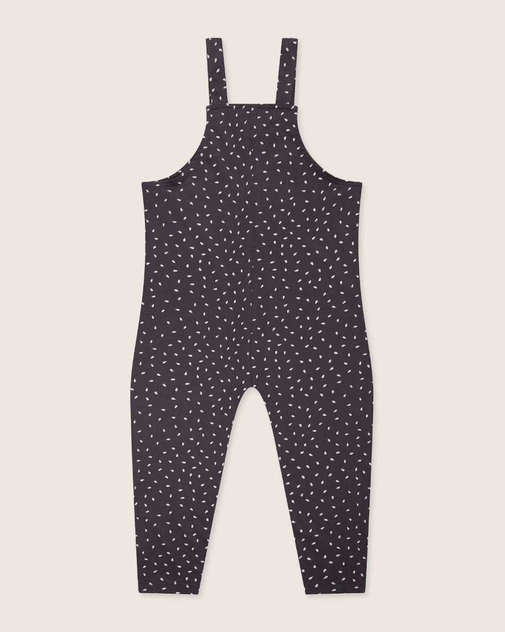 The Seeds Charcoal Dungarees are black toddler jumpsuits with tiny white specks on organic cotton, featuring shoulder straps and a loose fit. This eco-friendly piece is set against a plain off-white background, perfect for those seeking stylish and sustainable kids clothing.