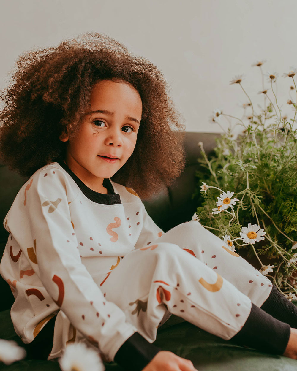 Girl wearing gender-neutral organic cotton kids joggers